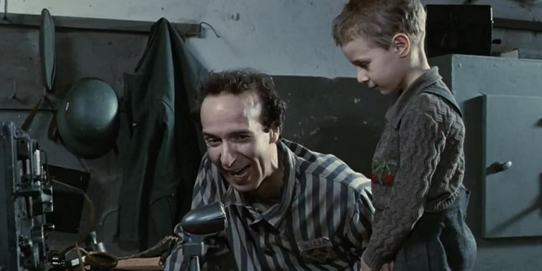 Roberto Benigni as Guido Orefice with Giorgio Cantarini as Giosuè Orefice his son in Life is Beautiful