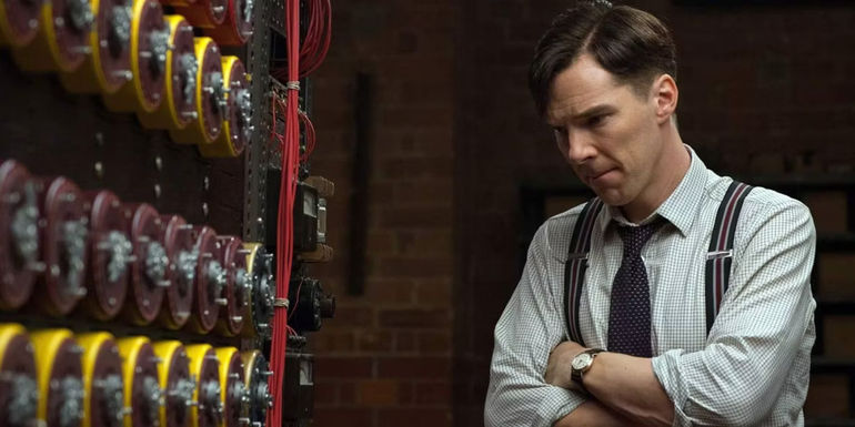 Alan Turing staring at a machine in The Imitation Game
