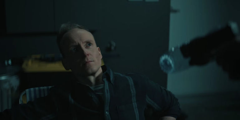 Jack Reacher pointing a gun at a man in Reacher season 2 ep 6