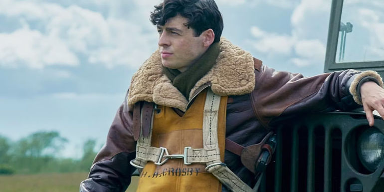 Anthony Boyle as Harry Crosby sitting on a car from Masters of the Air