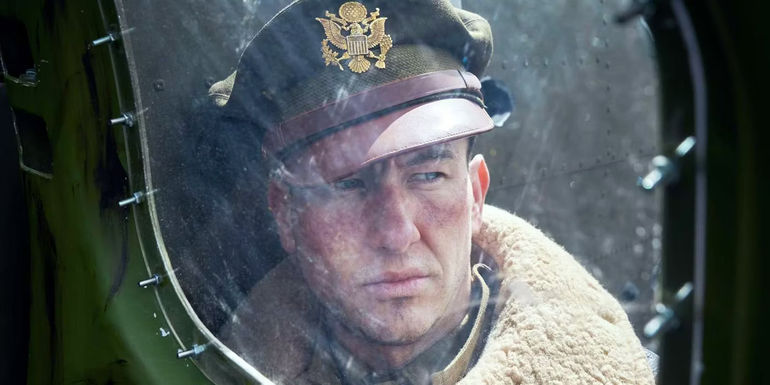 Barry Keoghan as Curtis Biddick through a plane window in Masters of the Air