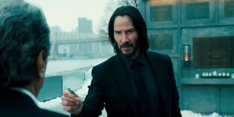 Keanu Reeves talking to Winston in John Wick 4.