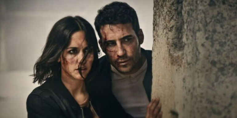 Paco (Miguel Ángel Silvestre) and Elena (Megan Montaner) trying to hide in 30 Coins season2.