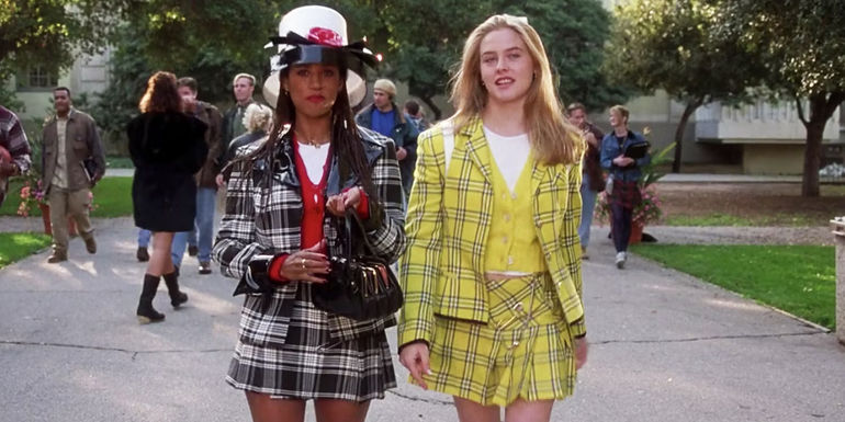Stacey Dash as Dionne Davenport and Alicia Silverstone as Cher Horowitz wearing their iconic outfits while walking to class in Clueless