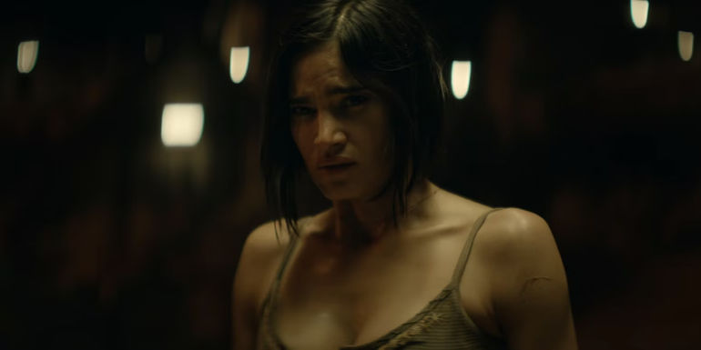 Sofia Boutella as Kora looking concerned in Rebel Moon.