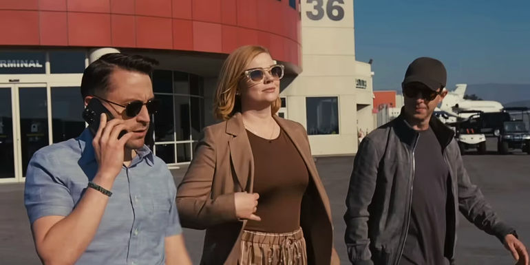 Ken, Roman, and Shive at an airport in Succession