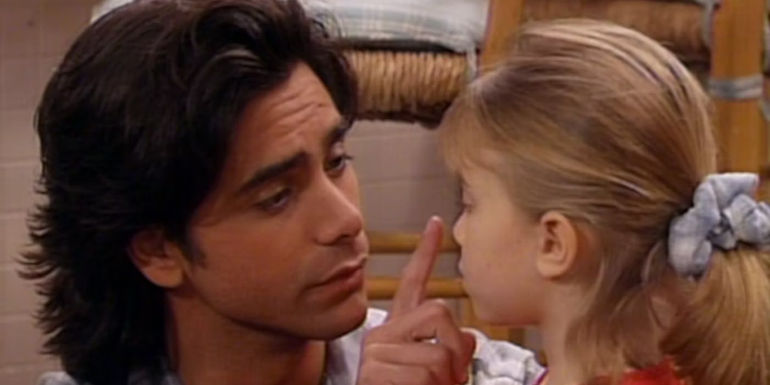 John Stamos as Jesse Katsopolis poking either Mary-Kate or Ashley Olsen as Michelle Tannernose in Full House