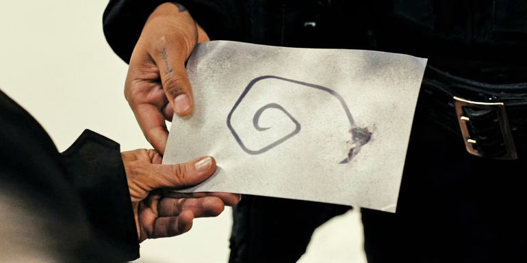 Danvers and Navarro Holding Paper Photo of Spiral Pattern in True Detective Night Country
