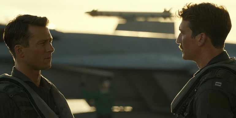 Rooster (Miles Teller) talks to Hangman (Glen Powell) in Top Gun Maverick