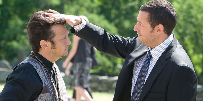 Adam Sandler patting Rob Schneider's head in Grown Ups
