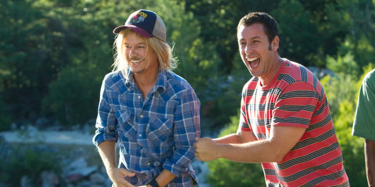 David Spade and Adam Sandler laughing in Grown Ups 2