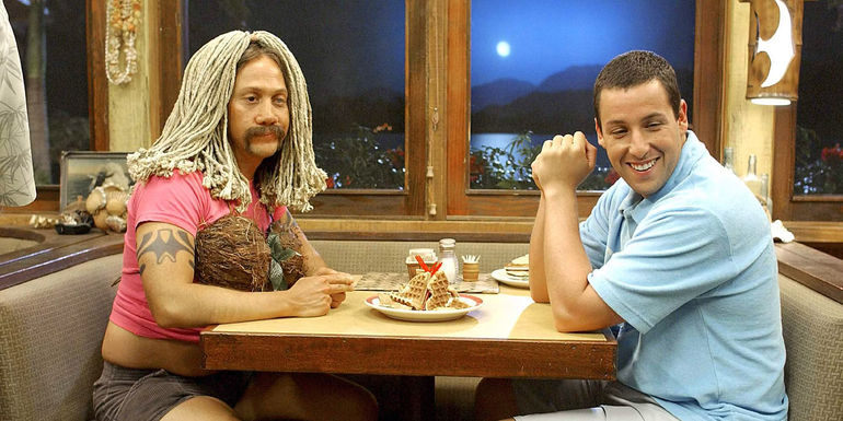 Rob Schneider dressed as a woman at a table with Adam Sandler in 50 First Dates