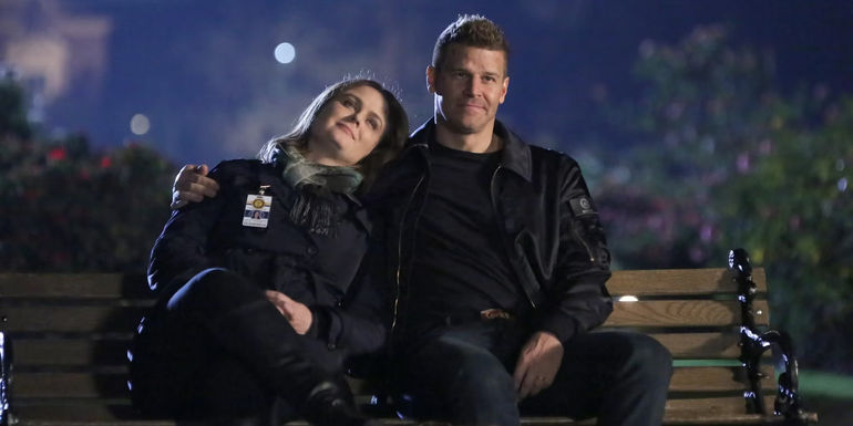 Brennan and Booth sitting on a bench in Bones Season 12