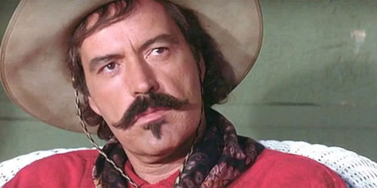 Culy Bill with his head tilted, looking at someone in Tombstone