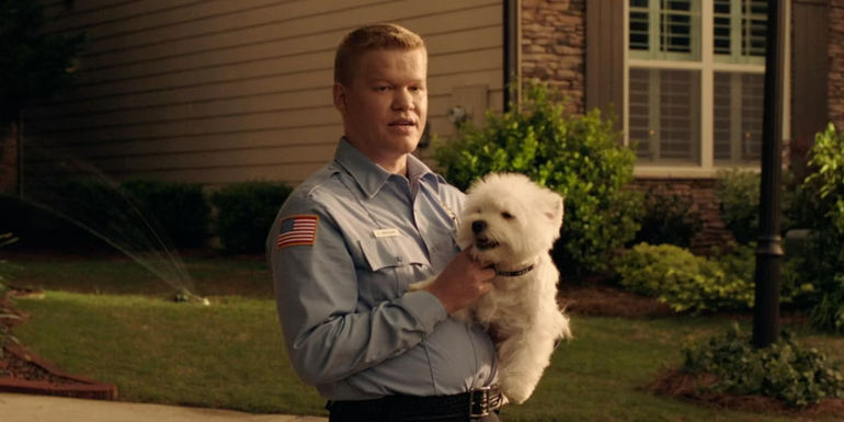 Gary from Game Night holding a dog