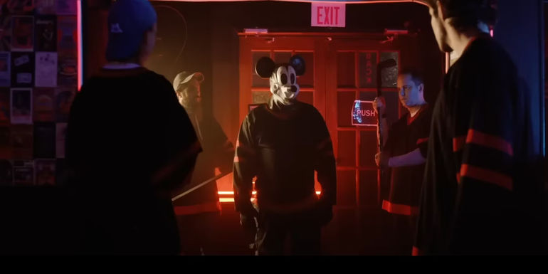 Mickey Mouse surrounded by people in Mickey's Mouse Trap 