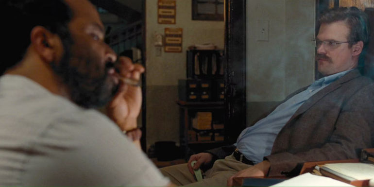 Gregg (David Harbour) and Felix (Jeffrey Wright) smoking cigars in Quantum of Solace