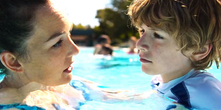 Sally looking at young Percy in front of her in the pool scene in Percy Jackson episode 4