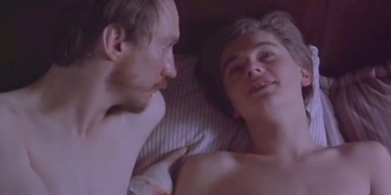 DiCaprio lays in bed with another man in Total Eclipse