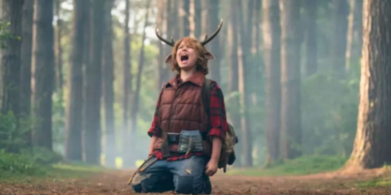 Gus on his knees and shouting in the woods in Sweet Tooth