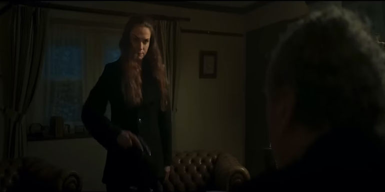 Kerry Condon holding a gun in In the Land of Saints and Sinners 