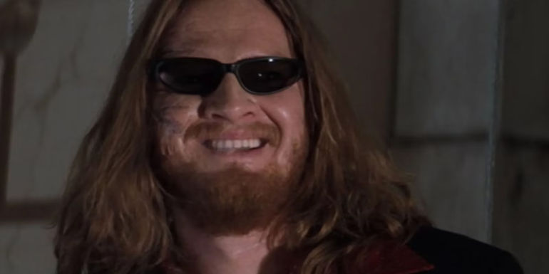 Donal Logue as Quinn smiling with sunglasses on