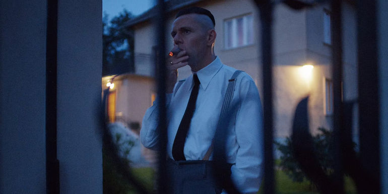 Christian Friedel as Rudolf Höss smoking in The Zone of Interest