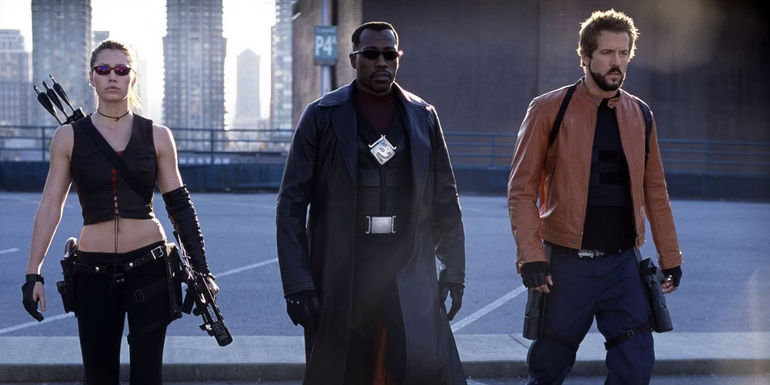 Jessica Biel as Abigail Whistler, Wesley Snipes as Blade, and Ryan Reynolds as Hannibal King walking together in Blade: Trinity.
