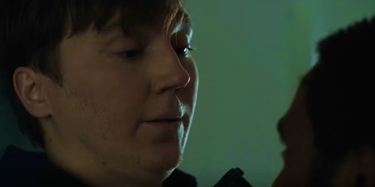 Paul Dano as Harris being held at gunpoint by Donald Glover's John in Mr. & Mrs. Smith's finale