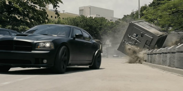 A car drags a vault in Fast Five