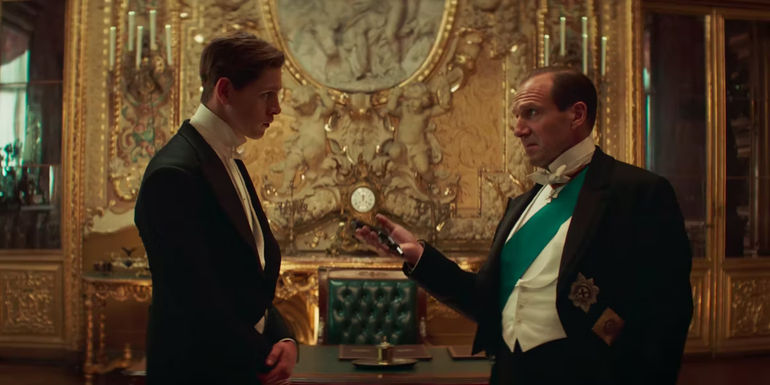 Harris Dickinson and Ralph Fiennes standing together in The King's Man 2 movie