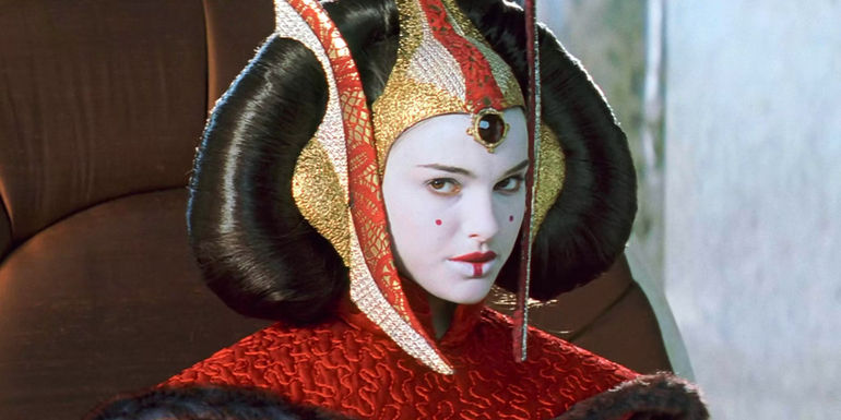 Padme Amidala looks stern in her red dress on Naboo in The Phantom Menace