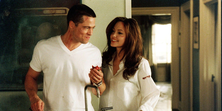 Mr. and Mrs. Smith smile at each other in Mr. & Mrs. Smith