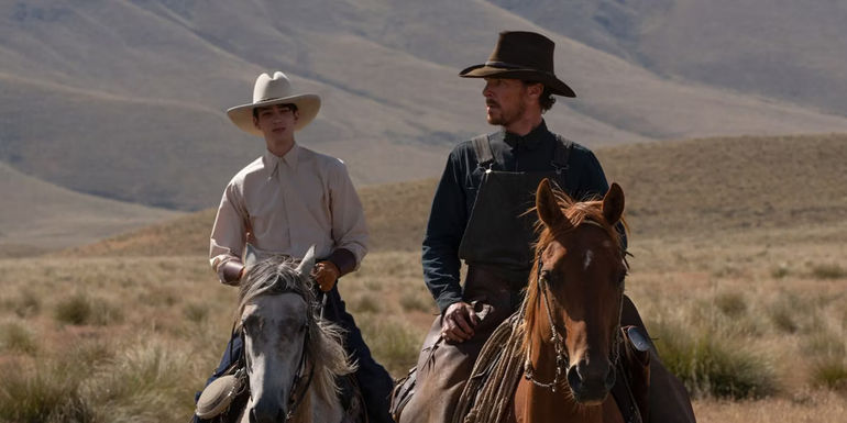Phil and Peter riding horses in The Power of the Dog.