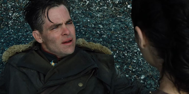 Steve Trevor (Chris Pine) confusingly looks at Wonder Woman (Gal Gadot) on Paradise Island in Wonder Woman 2017