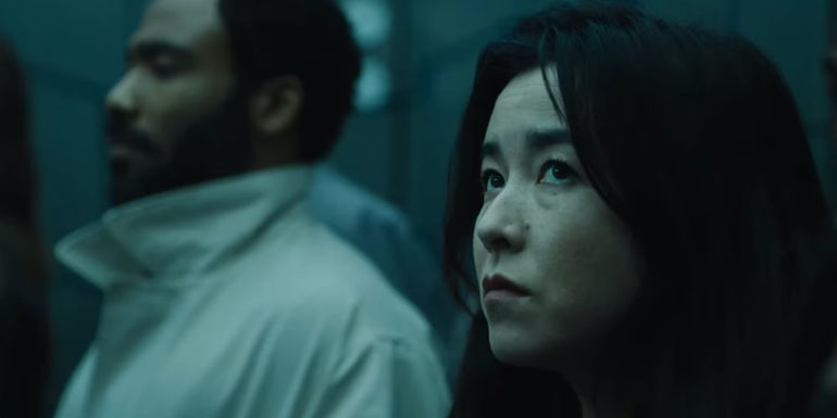 Maya Erskine and Donald Glover in an elevator in Mr. & Mrs. Smith 