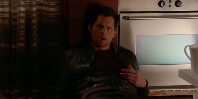 Caleb Brown (Kristoffer Polaha) laying on the ground after being shot in Castle.