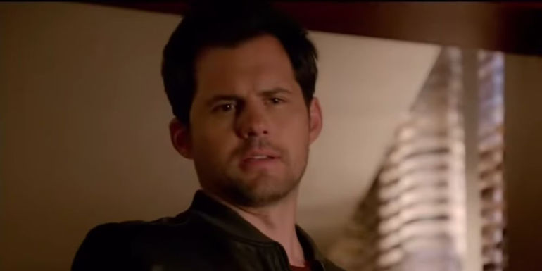 Caleb Brown (Kristoffer Polaha) pointing a gun in Castle.