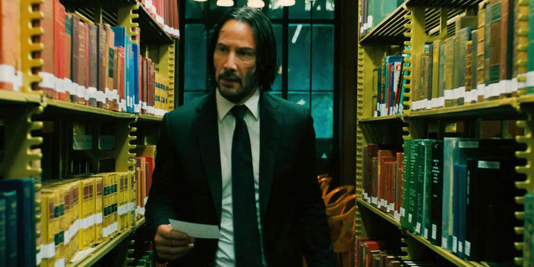 Keanu Reeves as John Wick in a library in John Wick 3