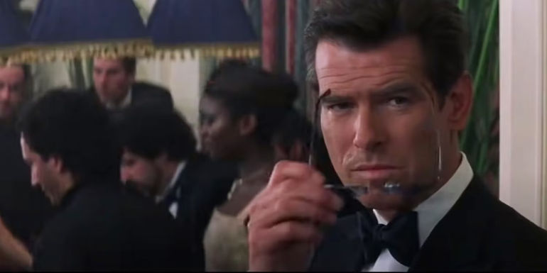 Pierce Brosnan as James Bond about to wear X-ray glasses in The World Is Not Enough