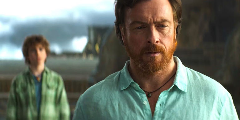 Poseidon standing with Percy in the background in Percy Jackson and the Olympians episode 8