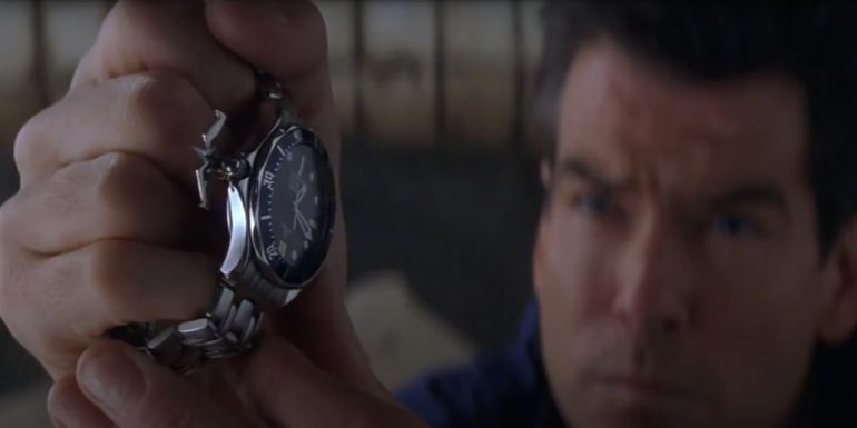 James Bond (Pierce Brosnan) about to fire the grappling hook from his watch in The World is not Enough