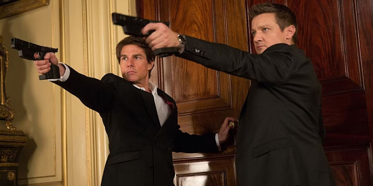 Tom Cruise and Jeremy Renner with guns in Mission Impossible Rogue Nation
