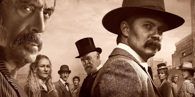 The cast assembled in the Deadwood The Movie Banner