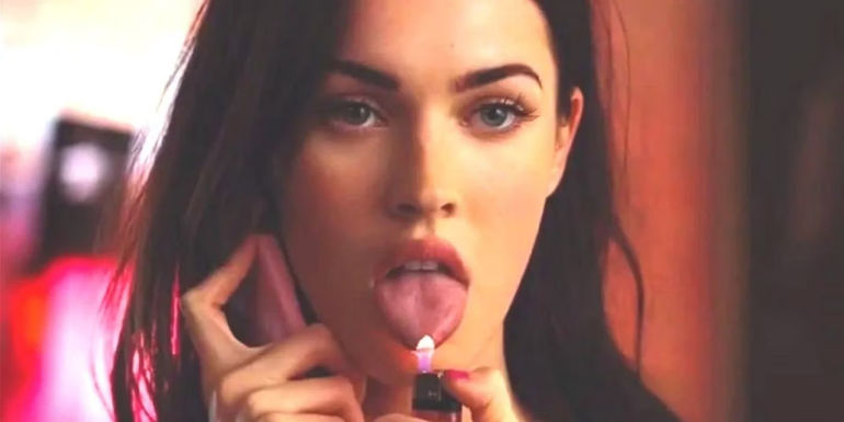 Megan Fox as Jennifer holds a lit flame up to her tongue in a scene from Jennifer's Body.