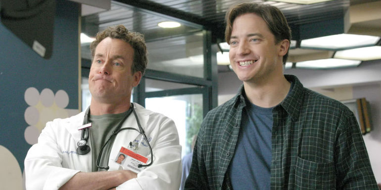 Brendan Fraser as Ben Sullivan smiles while standing next to John C. McGinley as Dr. Perry Cox from Scrubs 