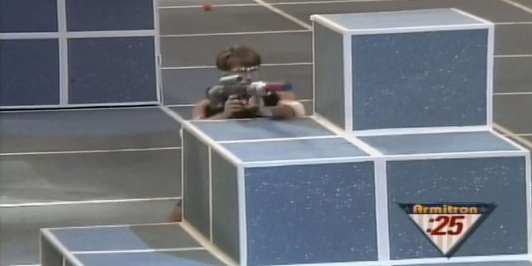 A man firing a toy gun in Assault in American Gladiators.-1
