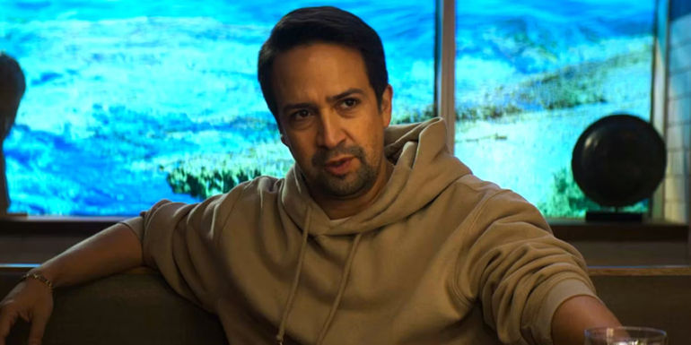 Lin-Manuel Miranda as Hermes sitting in Percy Jackson episode 6