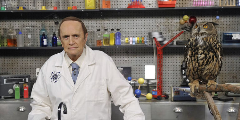 Bob Newhart's Professor proton stands at a desk in Young Sheldon