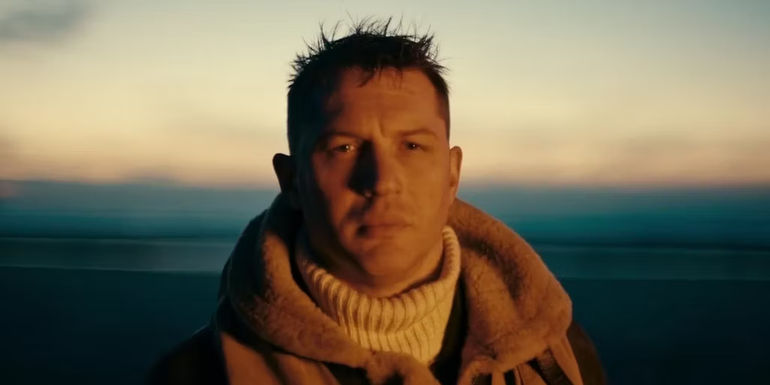 Tom Hardy as Farrier stands on the beach at the end of Dunkirk